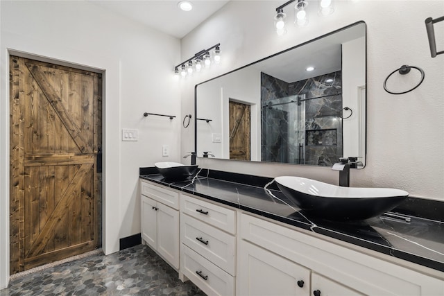 24717 Sligo St, Hempstead, TX 77445 - bathroom featuring double vanity, a sink, and a shower stall