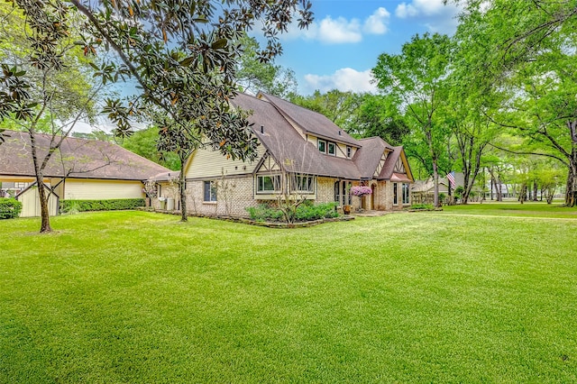 22814 Wren Ln, Tomball, TX 77377 - back of property featuring a yard and brick siding