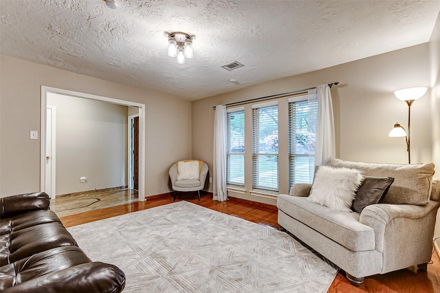 22814 Wren Ln, Tomball, TX 77377 - living room featuring a textured ceiling and wood finished floors
