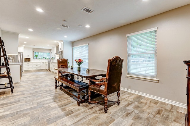 22814 Wren Ln, Tomball, TX 77377 - dining room featuring light wood-style flooring, recessed lighting, and baseboards