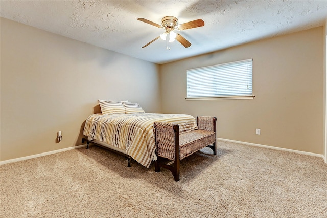 22814 Wren Ln, Tomball, TX 77377 - carpeted bedroom with baseboards, ceiling fan, and a textured ceiling