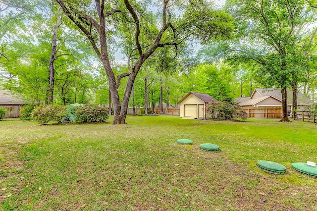 22814 Wren Ln, Tomball, TX 77377 - view of yard featuring an outdoor structure and a shed