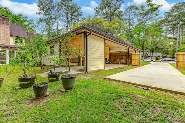 22814 Wren Ln, Tomball, TX 77377 - back of property with a gate and a patio area