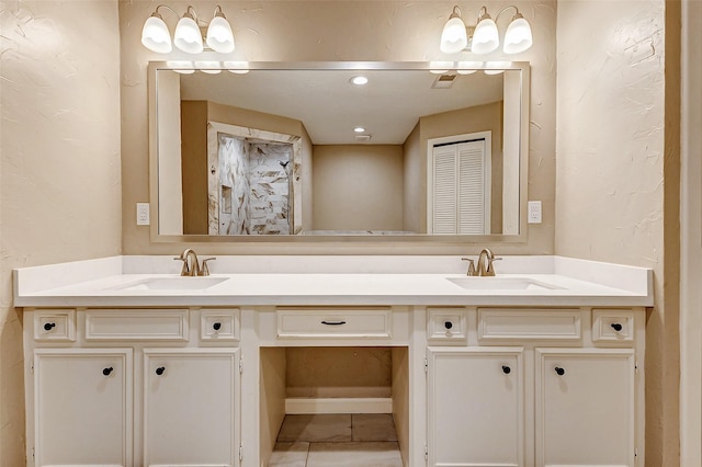 22814 Wren Ln, Tomball, TX 77377 - bathroom featuring double vanity and tile patterned floors