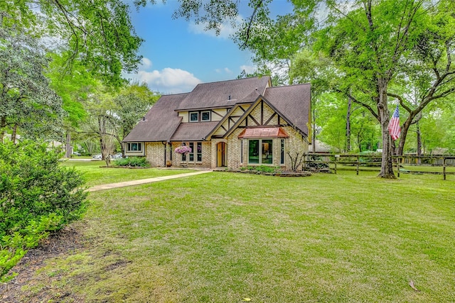 22814 Wren Ln, Tomball, TX 77377 - tudor house featuring brick siding
