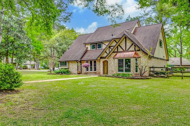 22814 Wren Ln, Tomball, TX 77377 - tudor home featuring brick siding
