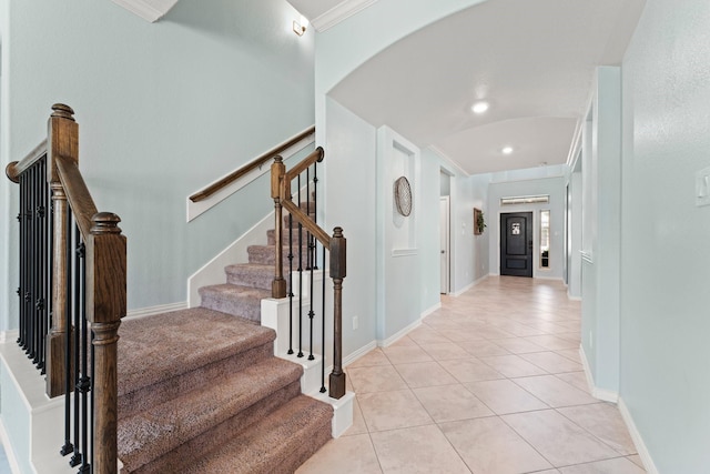 320 Cadela Dr, Montgomery, TX 77316 - interior space with tile patterned floors, arched walkways, crown molding, and baseboards