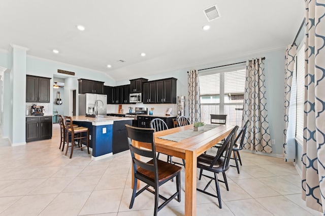 320 Cadela Dr, Montgomery, TX 77316 - dining room with light tile patterned floors, ornamental molding, and visible vents