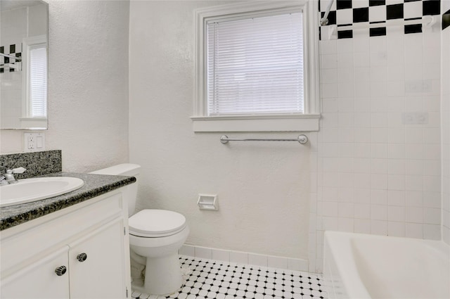 2348 Sheridan St, Houston, TX 77030 - full bathroom featuring vanity, toilet, baseboards, and a textured wall