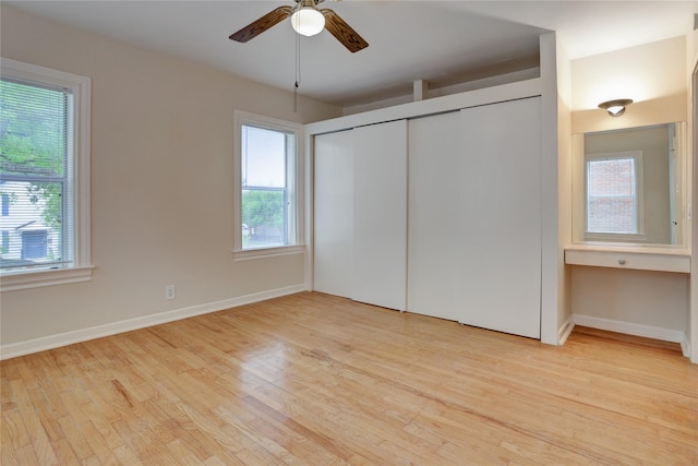 2348 Sheridan St, Houston, TX 77030 - unfurnished bedroom with light wood-style flooring, baseboards, a closet, and a ceiling fan