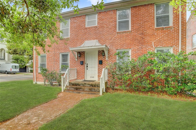2348 Sheridan St, Houston, TX 77030 - view of front of home featuring a front yard and brick siding