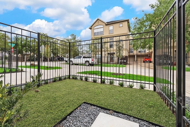 view of gate featuring fence