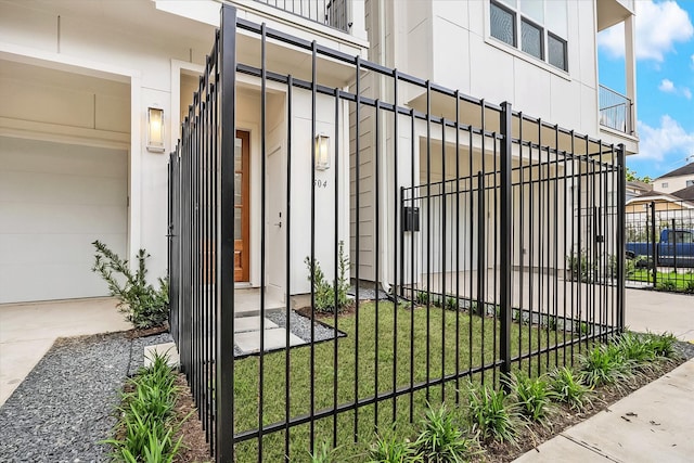 view of gate with fence