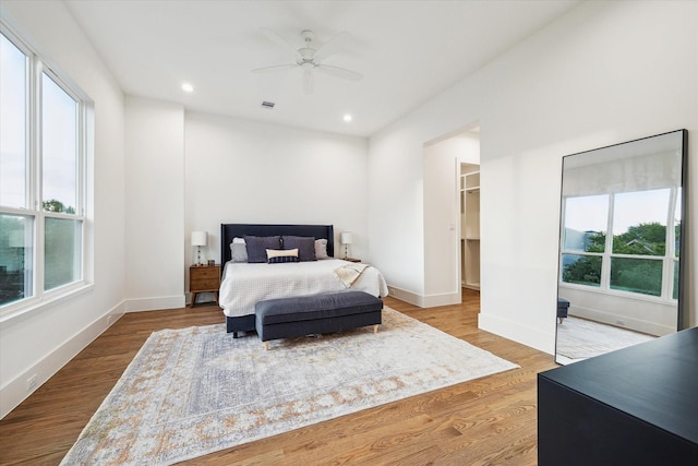bedroom with visible vents, recessed lighting, and wood finished floors