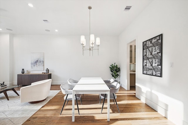 dining area with visible vents, an inviting chandelier, light wood finished floors, and recessed lighting