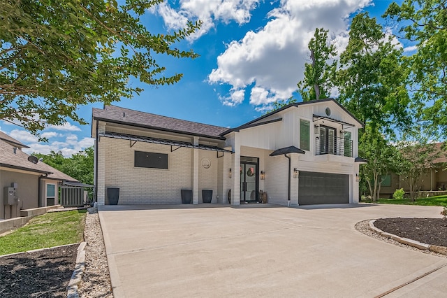 3734 Windswept Dr, Montgomery, TX 77356 - view of front facade with brick siding, an attached garage, and concrete driveway