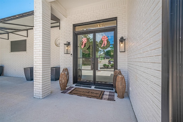 3734 Windswept Dr, Montgomery, TX 77356 - doorway to property featuring brick siding and french doors