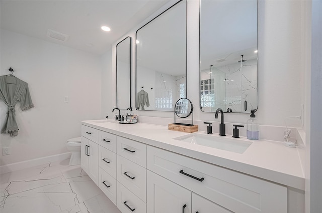 3734 Windswept Dr, Montgomery, TX 77356 - full bathroom featuring a marble finish shower, marble finish floors, double vanity, toilet, and baseboards