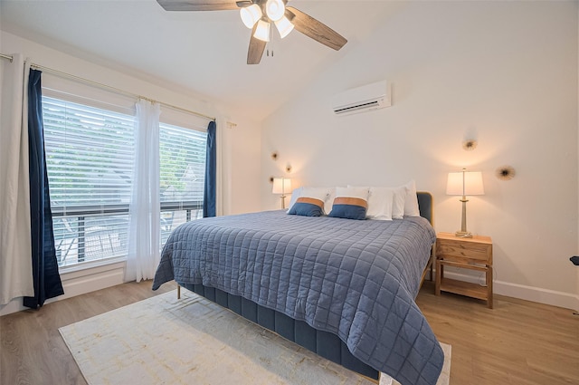 3734 Windswept Dr, Montgomery, TX 77356 - bedroom with a wall mounted air conditioner, light wood-type flooring, vaulted ceiling, baseboards, and a ceiling fan
