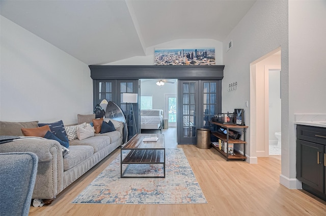3734 Windswept Dr, Montgomery, TX 77356 - living room featuring vaulted ceiling, light wood-style floors, ceiling fan, and baseboards