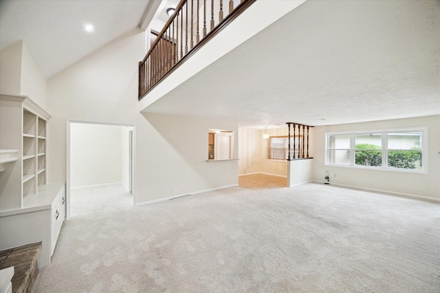 6106 Greenmont Dr, Houston, TX 77092 - unfurnished living room featuring carpet, baseboards, and a high ceiling
