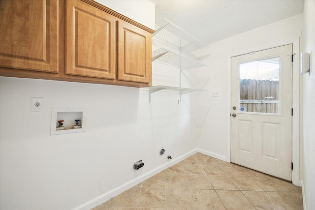 6106 Greenmont Dr, Houston, TX 77092 - laundry room featuring hookup for a gas dryer, washer hookup, electric dryer hookup, baseboards, and cabinet space