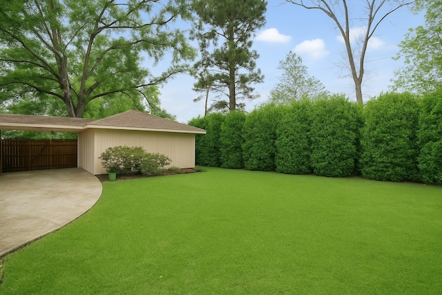 6106 Greenmont Dr, Houston, TX 77092 - view of yard with fence, an attached carport, and concrete driveway