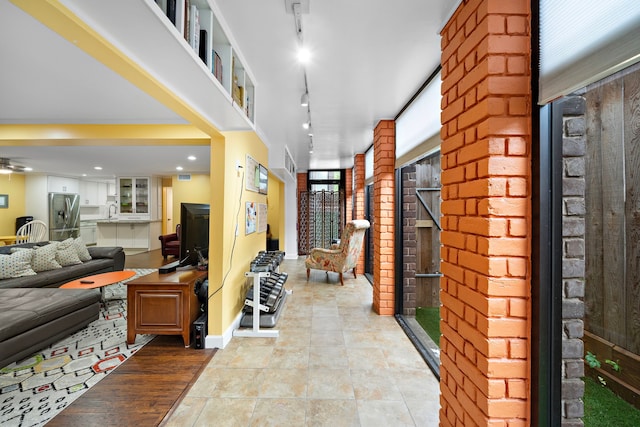 7575 Katy Fwy Unit 4, Houston, TX 77024 - corridor featuring a sink and baseboards