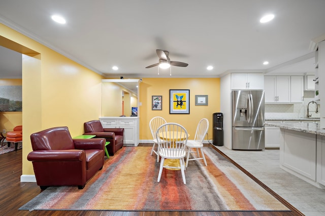 7575 Katy Fwy Unit 4, Houston, TX 77024 - dining area with crown molding, a ceiling fan, recessed lighting, light wood-type flooring, and baseboards