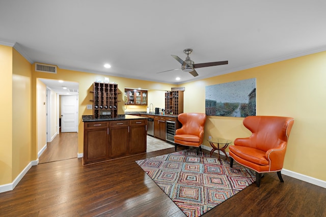 7575 Katy Fwy Unit 4, Houston, TX 77024 - office area featuring dark wood finished floors, crown molding, baseboards, bar, and ceiling fan
