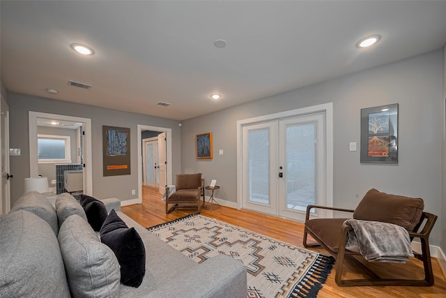 2311 Branard St, Houston, TX 77098 - living area featuring french doors, visible vents, and light wood-style floors