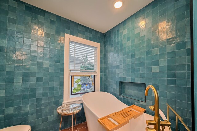 2311 Branard St, Houston, TX 77098 - bathroom featuring a freestanding bath, tile walls, and recessed lighting