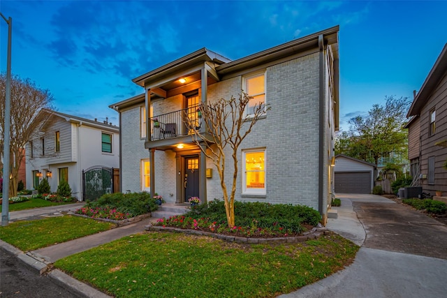 2311 Branard St, Houston, TX 77098 - view of front facade featuring an outdoor structure, brick siding, and a balcony