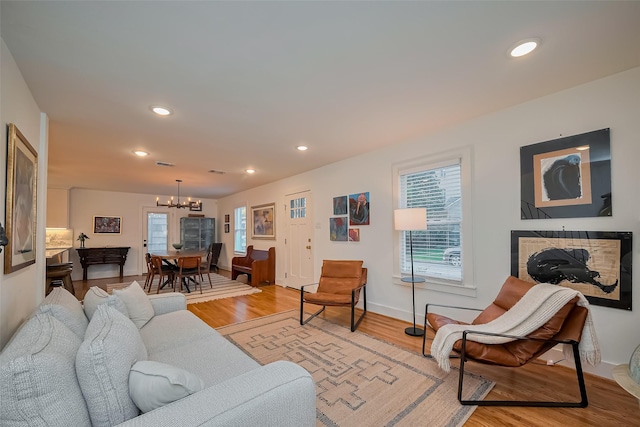 2311 Branard St, Houston, TX 77098 - living area with a notable chandelier, light wood finished floors, and recessed lighting