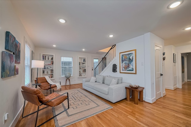 2311 Branard St, Houston, TX 77098 - living room with stairs, light wood-type flooring, built in features, baseboards, and recessed lighting
