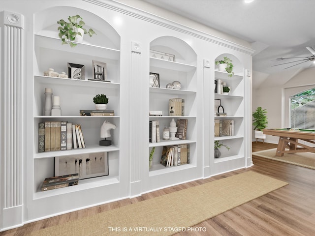 detailed view of wood finished floors, a ceiling fan, and built in features