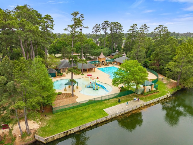 bird's eye view of a pool and a nearby body of water