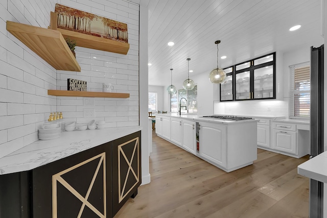 4730 Pitts Rd, Katy, TX 77493 - kitchen with open shelves, gas cooktop, white cabinetry, a sink, and recessed lighting