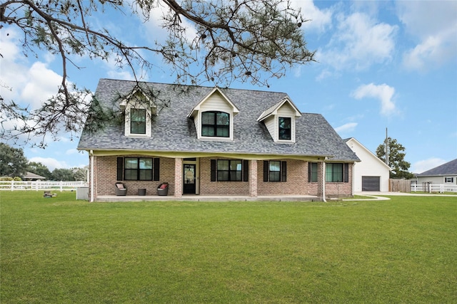 4730 Pitts Rd, Katy, TX 77493 - cape cod-style house featuring a garage, brick siding, and roof with shingles