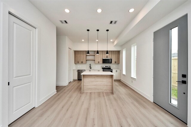 4601 White Rock St, Houston, TX 77051 - kitchen with stainless steel appliances, visible vents, light countertops, and a kitchen island
