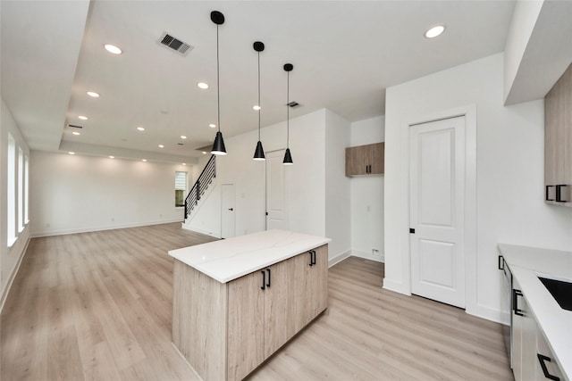 4601 White Rock St, Houston, TX 77051 - kitchen featuring recessed lighting, light wood-type flooring, visible vents, and modern cabinets