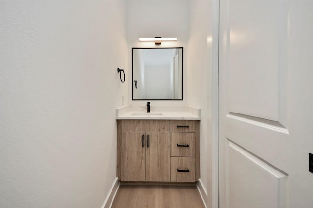 4601 White Rock St, Houston, TX 77051 - bathroom with baseboards, vanity, and wood finished floors