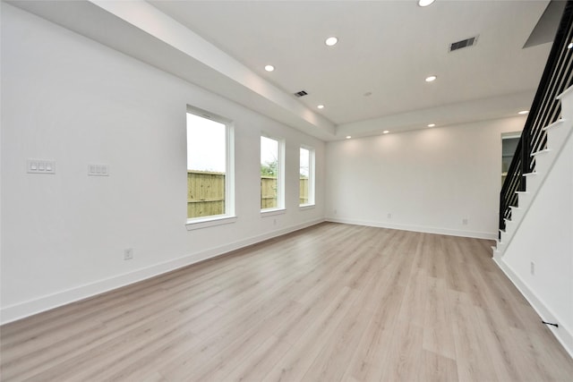 4601 White Rock St, Houston, TX 77051 - unfurnished living room with light wood-type flooring, visible vents, recessed lighting, stairway, and baseboards