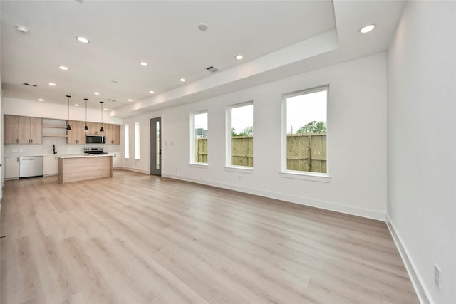 4601 White Rock St, Houston, TX 77051 - unfurnished living room featuring light wood-style floors, recessed lighting, visible vents, and baseboards