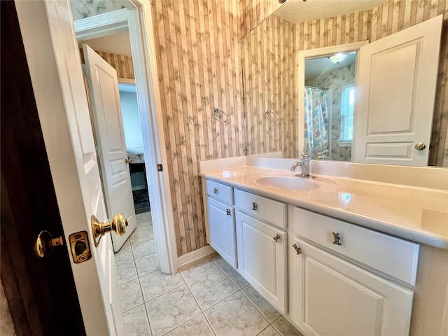 2914 Renoir, Sugar Land, TX 77479 - bathroom with wallpapered walls, vanity, and baseboards