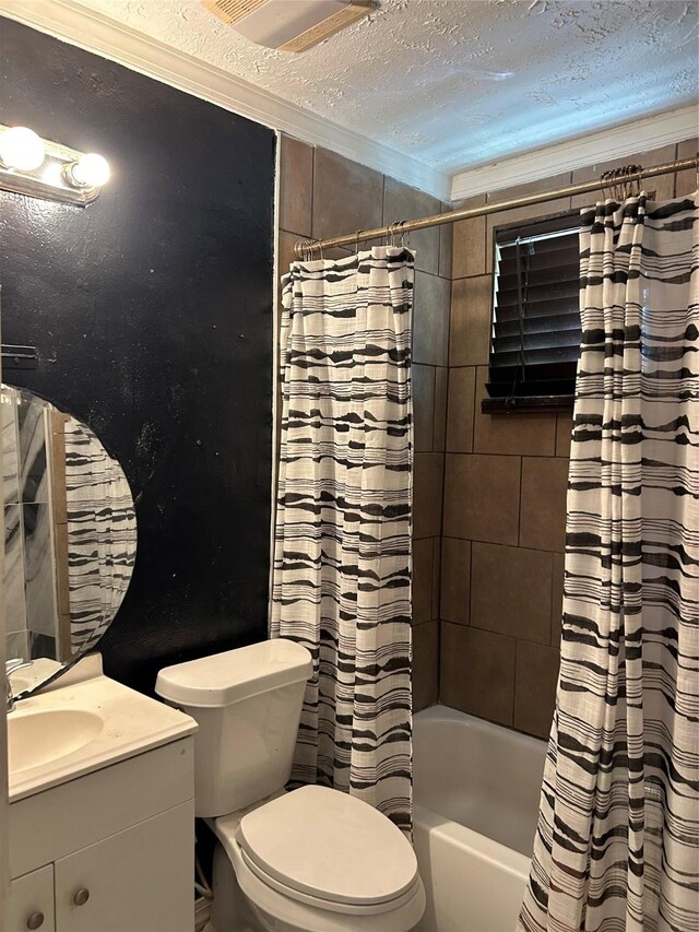full bath featuring crown molding, shower / bath combo, toilet, a textured ceiling, and vanity