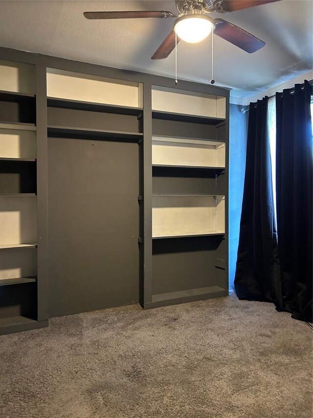 unfurnished bedroom with carpet and ceiling fan