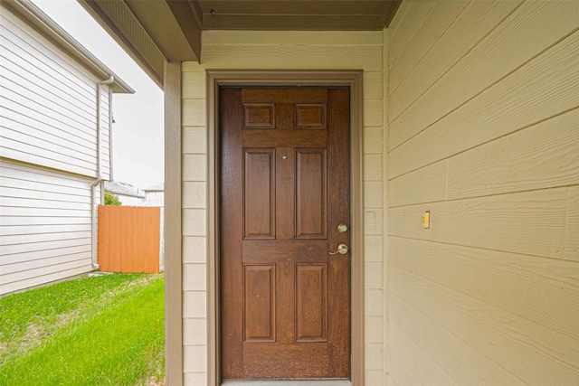property entrance featuring fence