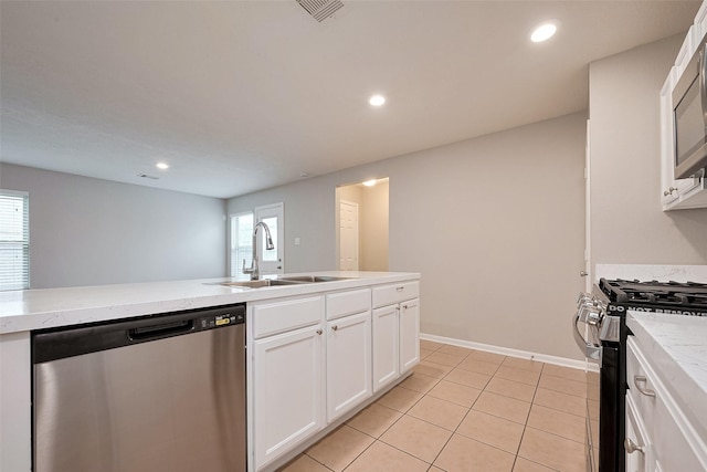kitchen featuring recessed lighting, a sink, visible vents, white cabinets, and appliances with stainless steel finishes
