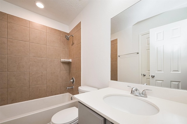 full bath with shower / bath combination, toilet, vanity, and a textured ceiling